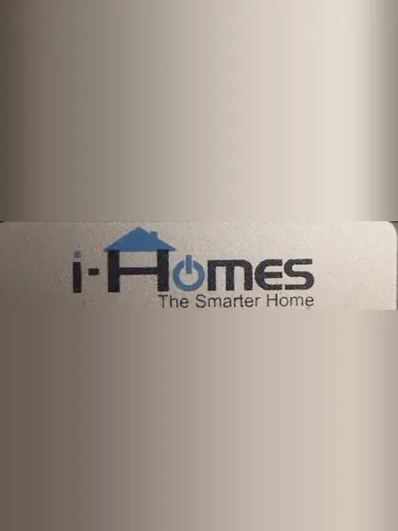 iHomes sticker reading i-Homes, The Smarter Home, on the front of a black glossy Control4 unit