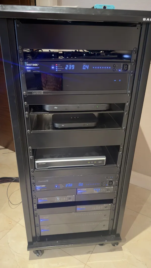 Finished floor standing equipment rack in Cork with power controllers, Control4 controllers, Sky boxes, a CCTV recorder and multichannel amplifiers