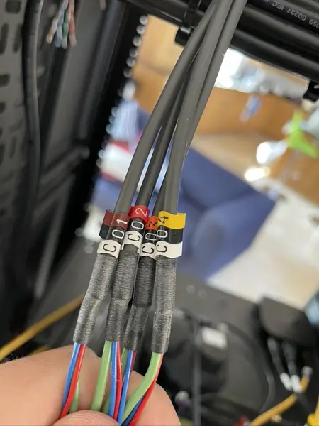 Control cables with numbered labels C01 to C04 and heat shrink sleeves