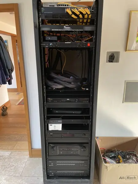 Front of the equipment rack during the upgrade, with the network switch at the top and the two Crestron six room audio systems at the bottom