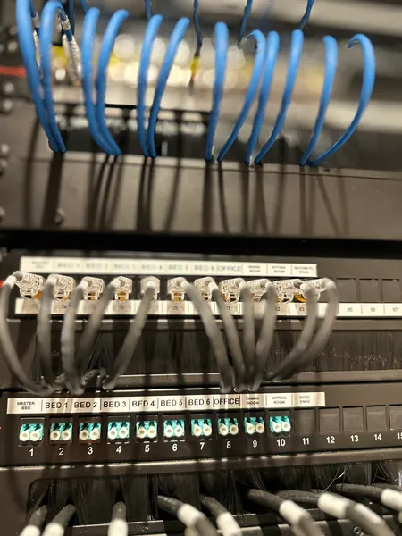 Fibre patch panel with each bedroom, the office and the living rooms labelled