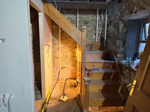 The new staircase at Ivy Cottage in Roscommon with first fix cables run along the stud walls before the plasterboard