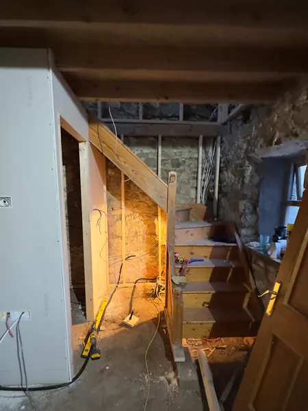 The landing and stair framing in new timber inside the stone cottage