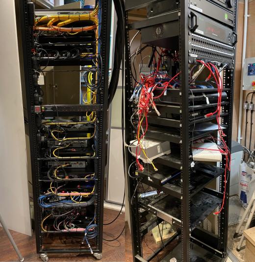 A pair of AV racks full of loose, tangled leads at the start of a rescue job
