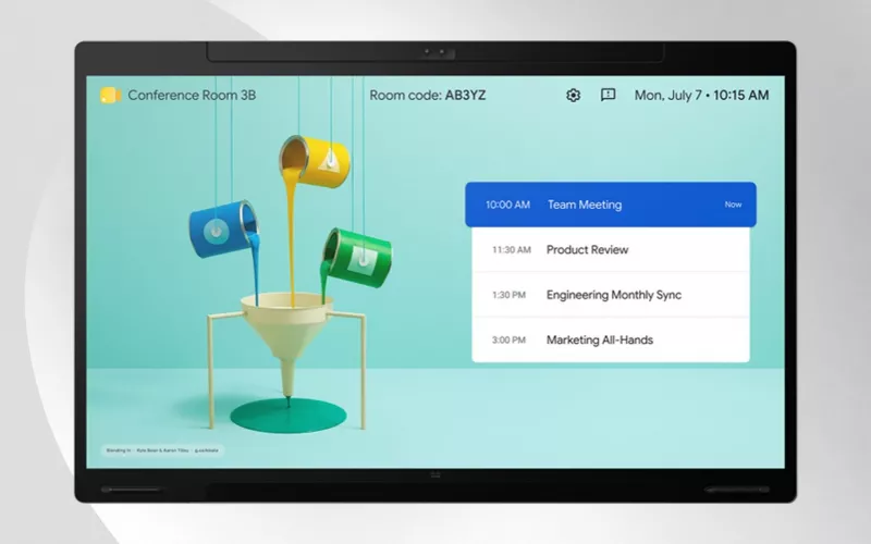 Cisco display with a camera in its top bezel showing a room home screen with a room code and the day's meetings, pictured by Cisco for its Cisco Google Meet news