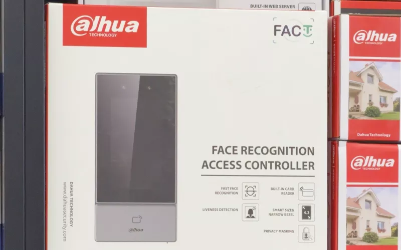 Dahua face recognition access controller in its box on a shelf beside two Dahua door station boxes, the reader we fit for face recognition access control in Cork