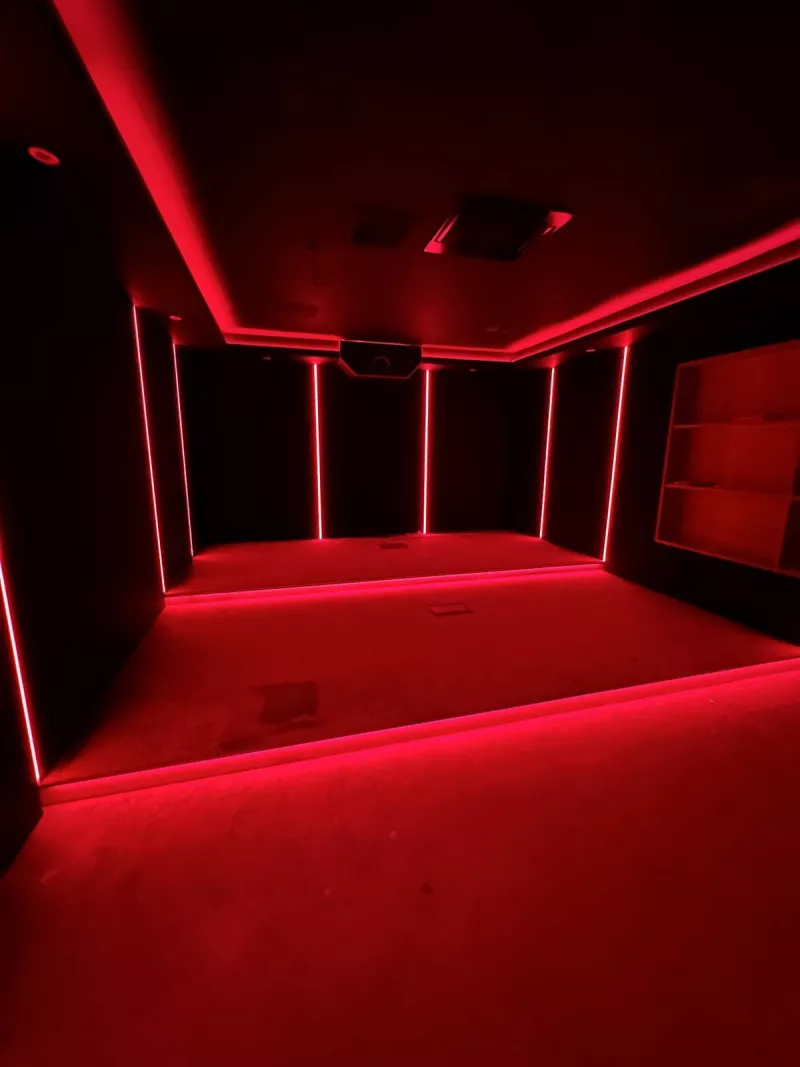 LED lighting on test in red along the walls, ceiling and staged floor