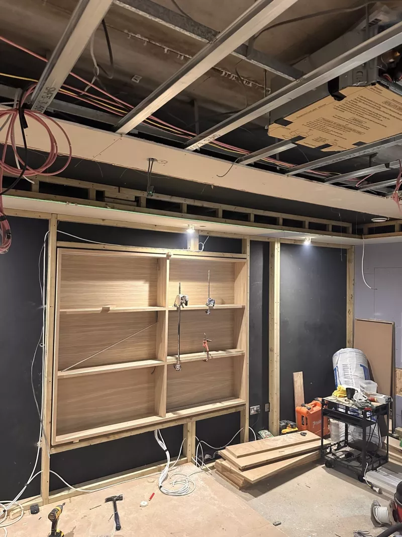 Custom shelf unit built into the stud wall where the window used to be