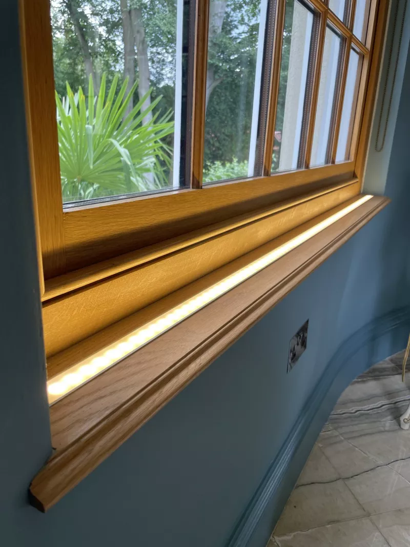 Oak window sill with a warm LED strip set into it