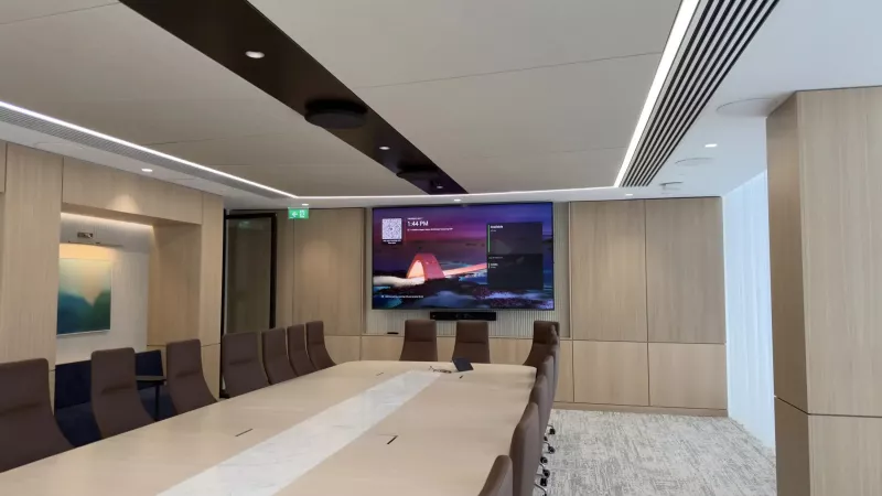 Boardroom with large display and ceiling microphones in a Dublin office