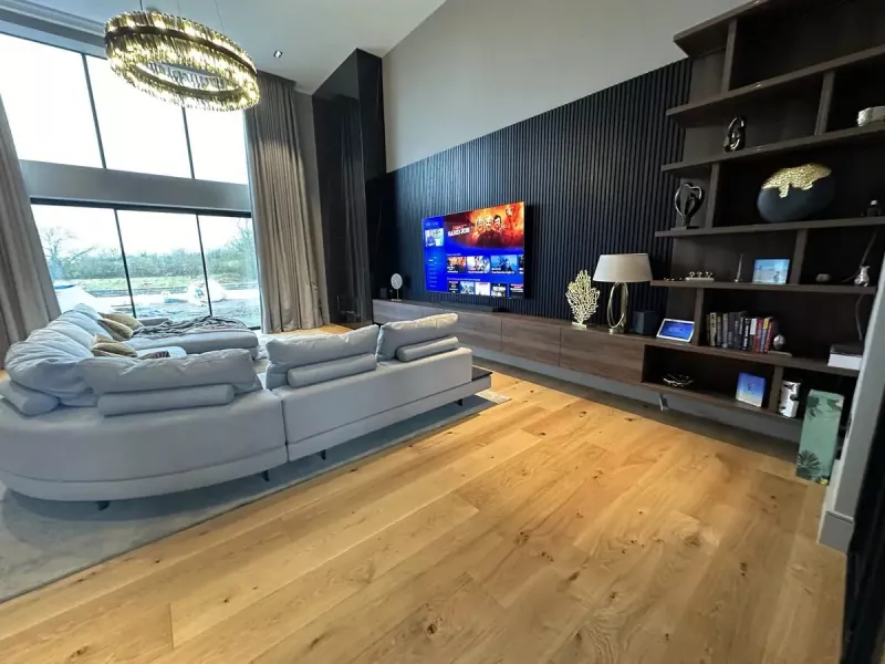 Double height living room with integrated TV and audio in Foxrock, Dublin