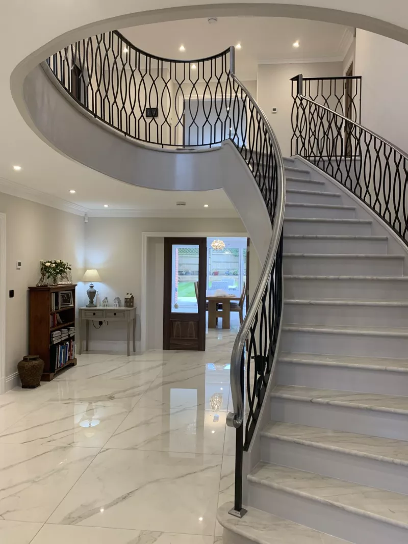Sweeping staircase and entrance hall
