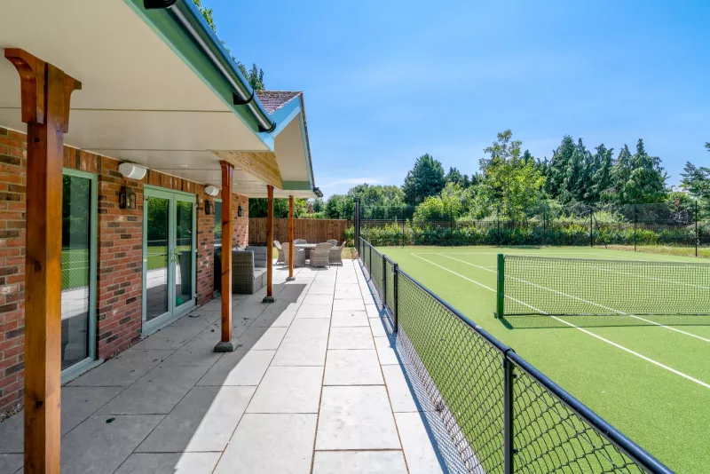 The terrace and tennis court