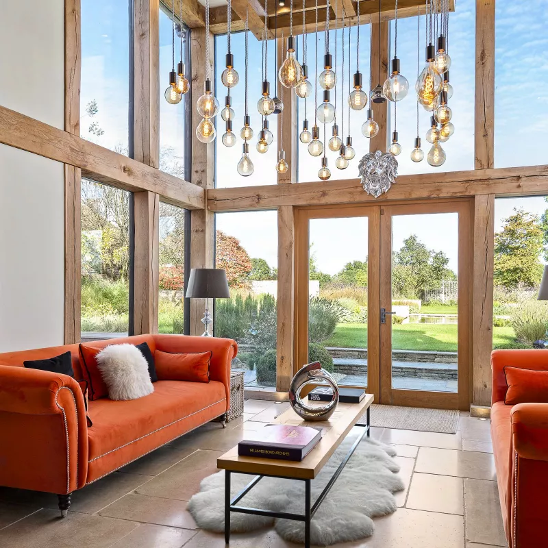 Double height living room with pendant lights