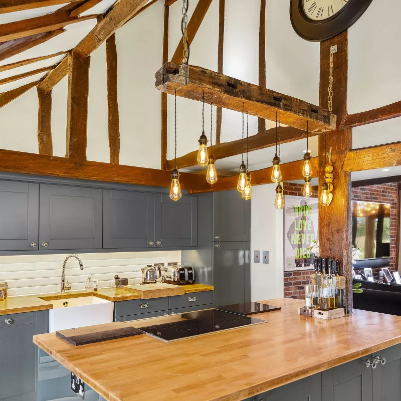 The kitchen with pendant lighting