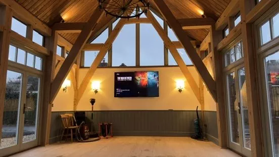 The vaulted oak room with feature lighting