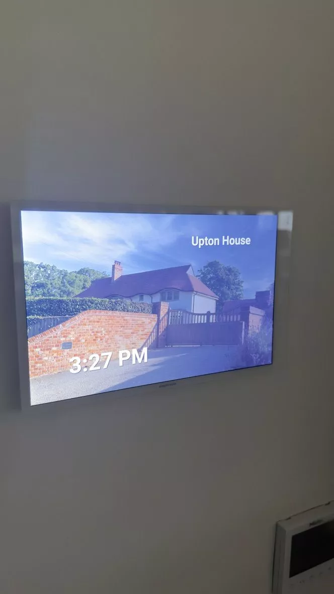 Crestron touch screen showing the home screen