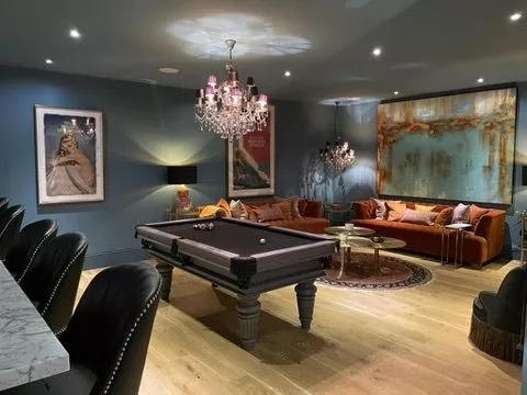 The games room with pool table and bar