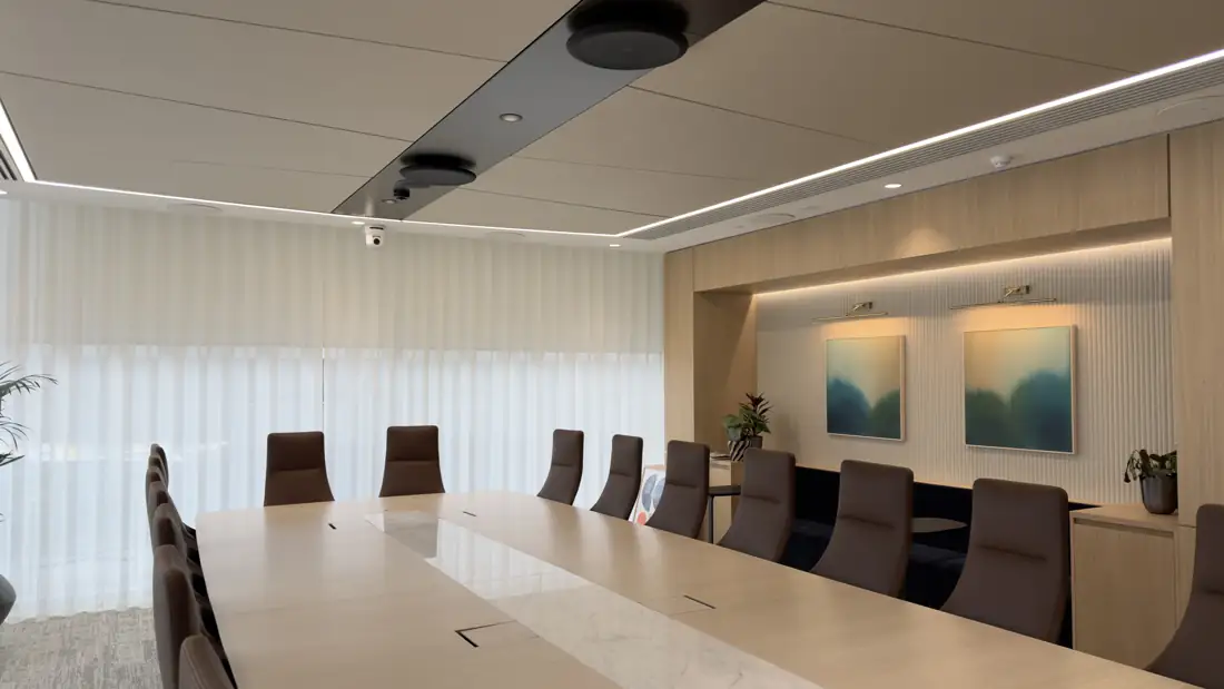 Office boardroom with conferencing display